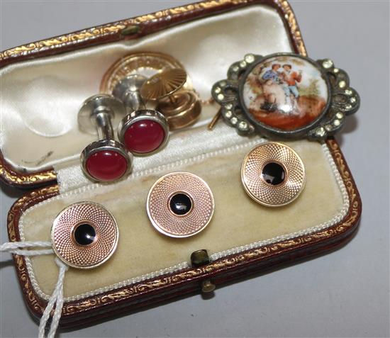 A cased set of three engine turned 9ct gold and black enamel dress studs and four other items.